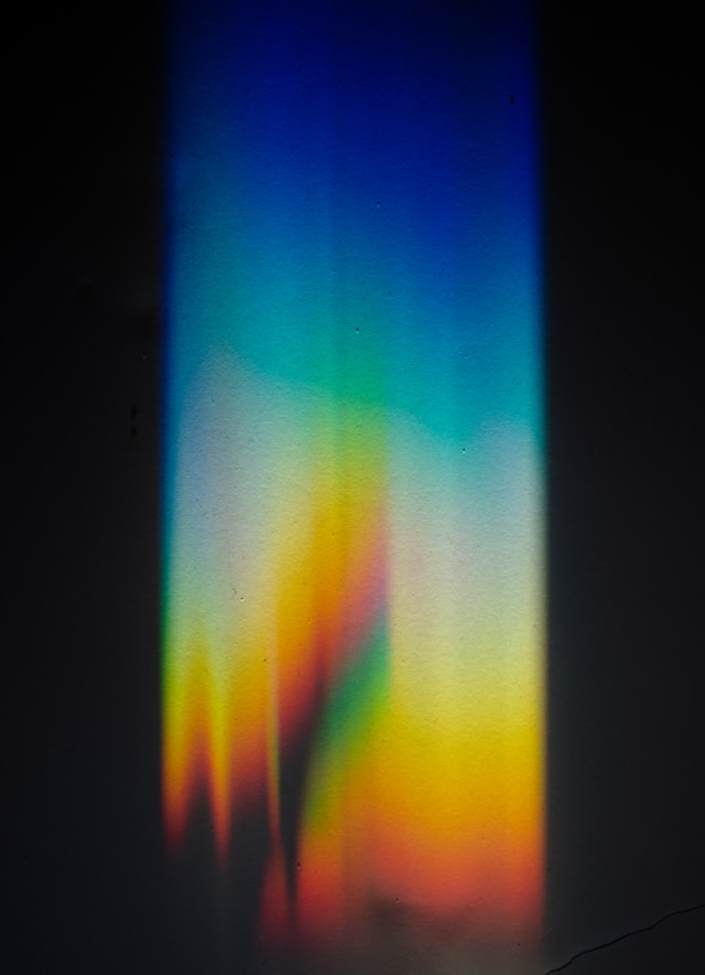 A picture of light refracted by a prism onto a wall